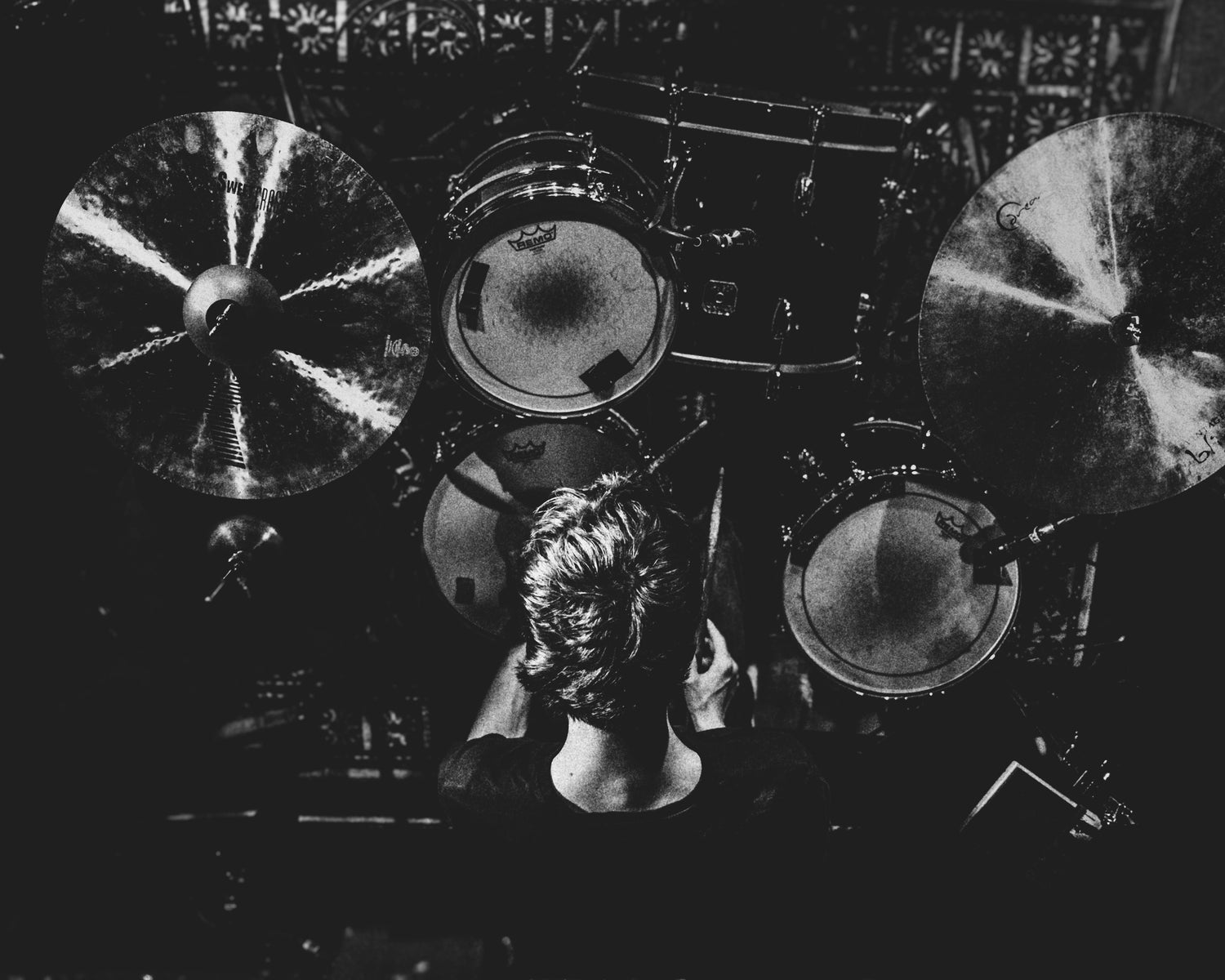 Louis Tuxworth, the drummer from the band Gravy photographed from a birdseye view