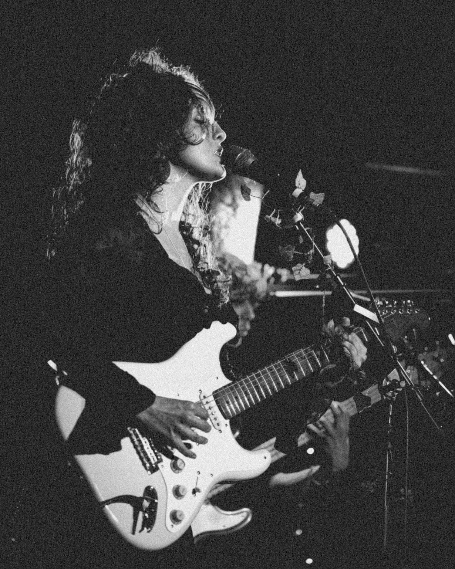 Monochrome live photo of Heidi Curtis performing with guitar at The Cluny in Newcastle