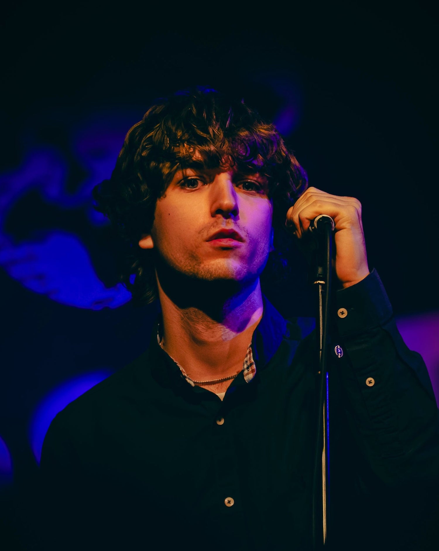 Lead singer of Marseille performing live on stage