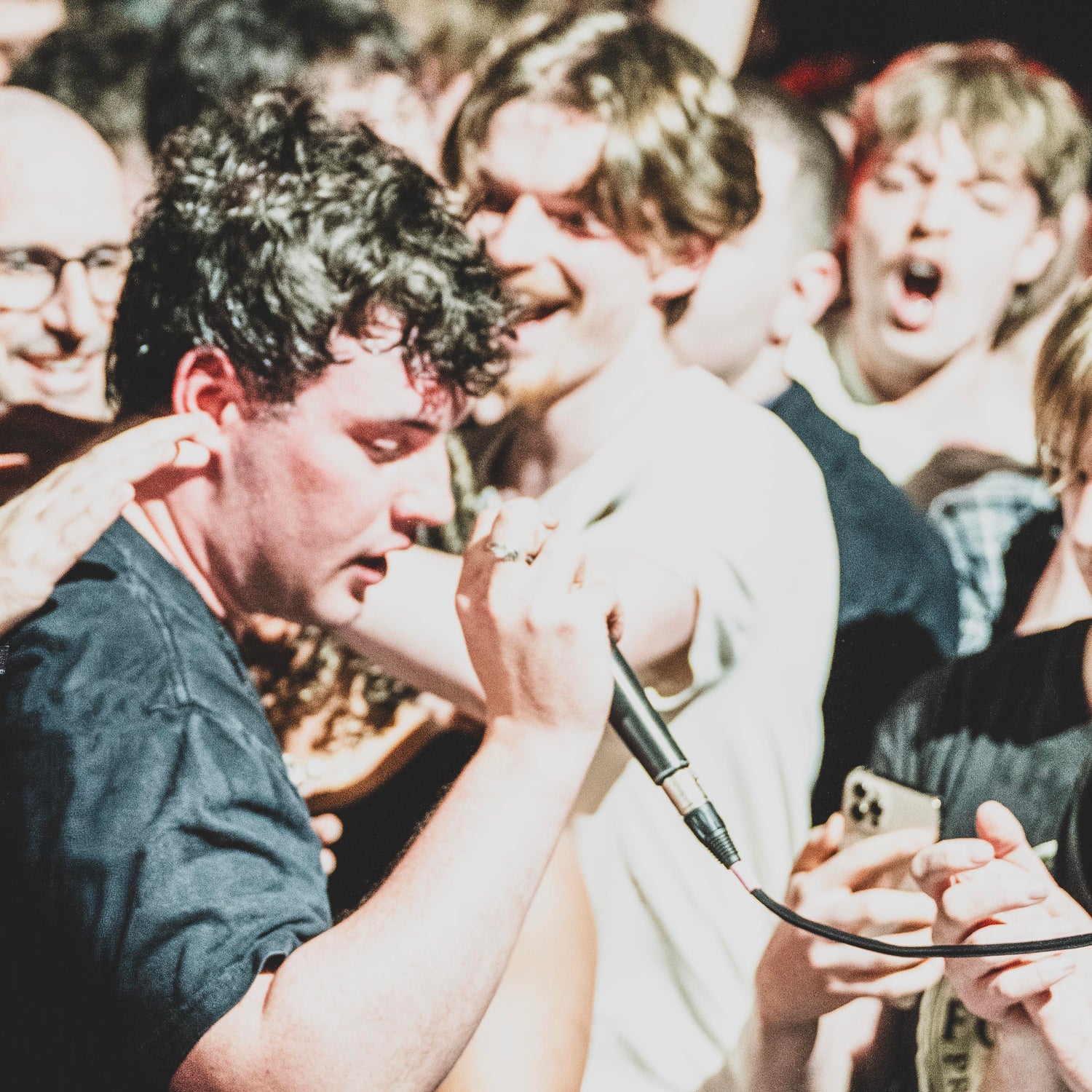 Basht playing at The Cluny in Newcastle, Jack Leavey in the crowd with fans