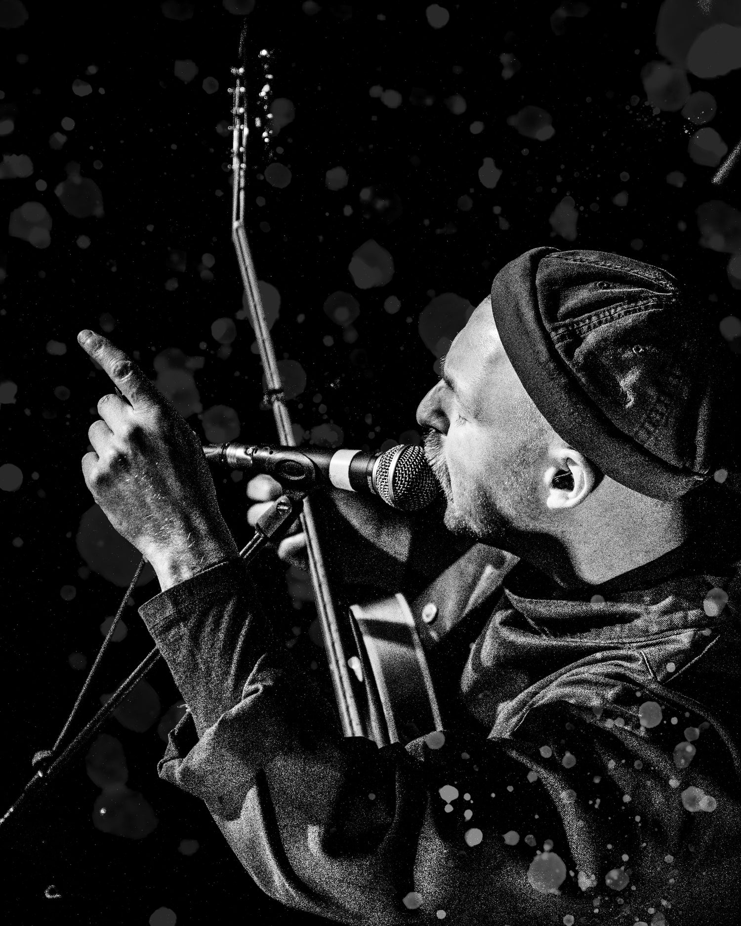 Hector Gannet playing at The Cluny in Newcastle - Aaron Duff singing into a microphone with a distorted background