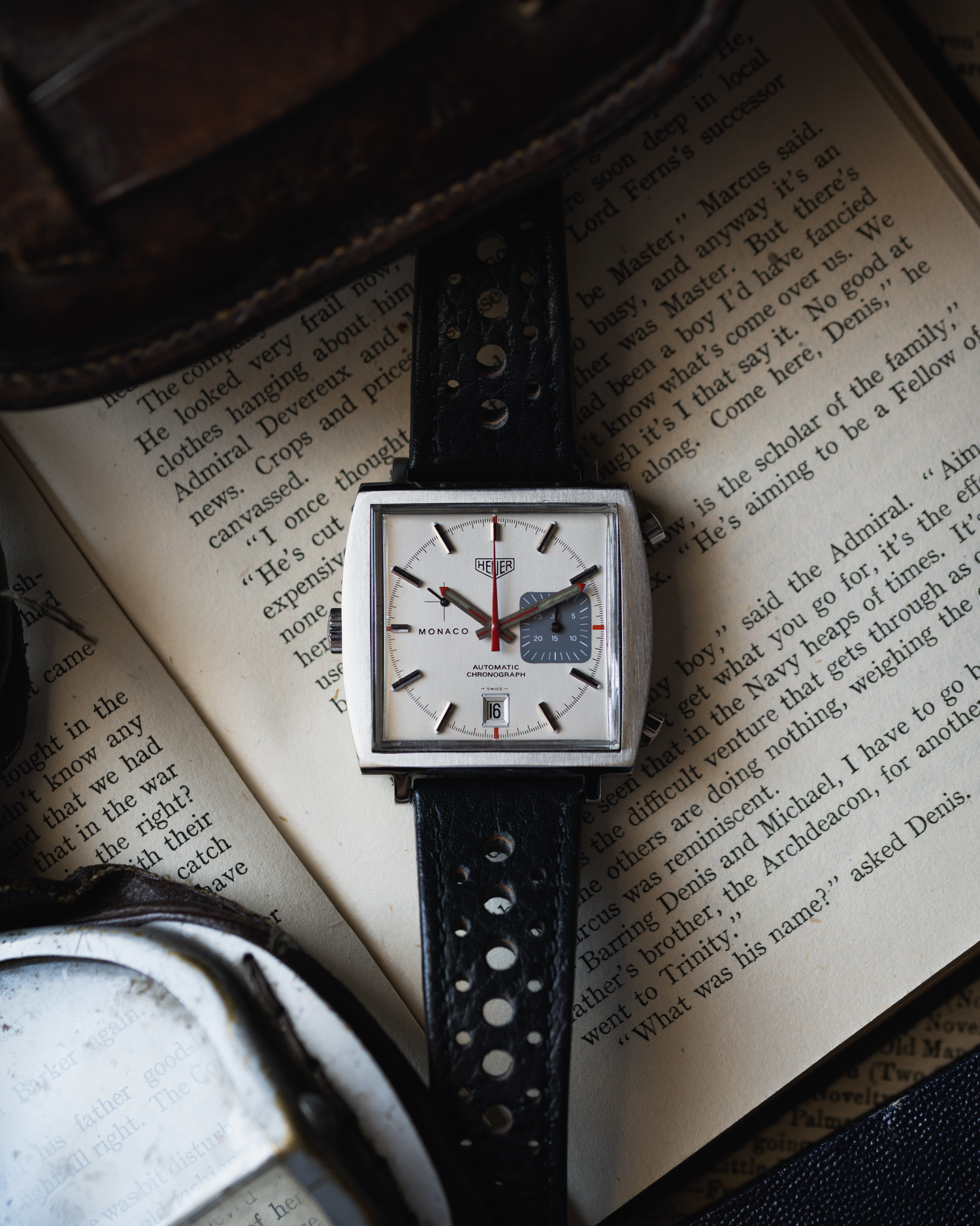 Heuer Monaco photographed on an open book