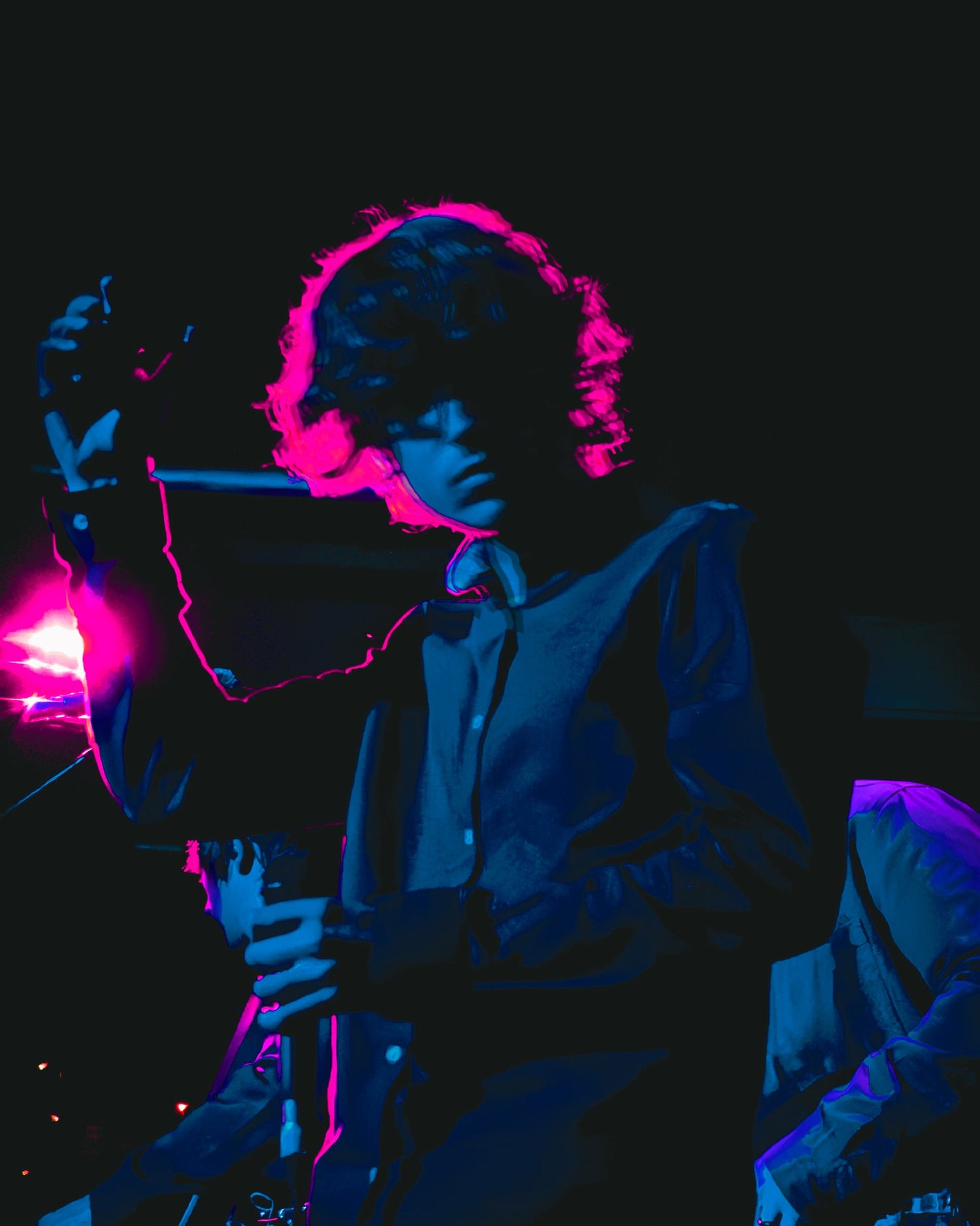 Lead singer of Marseille performing live on stage in Newcastle