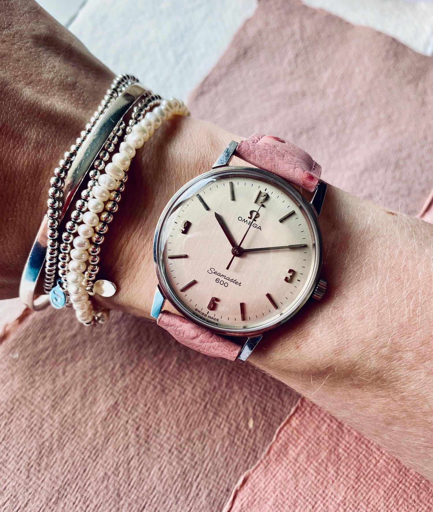 omega seamaster 600 photographed on a ladies wrist