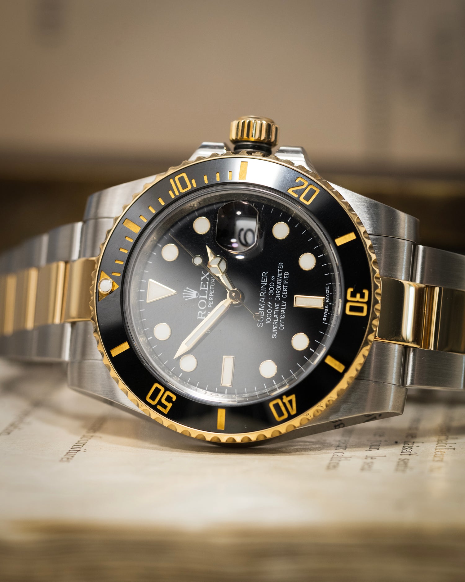 A Rolex Submariner Bi Metal photographed on its side 